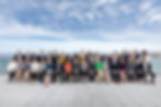 Large group of people in business attire outdoors for the 2019 D9 Summit held in Uruguay.