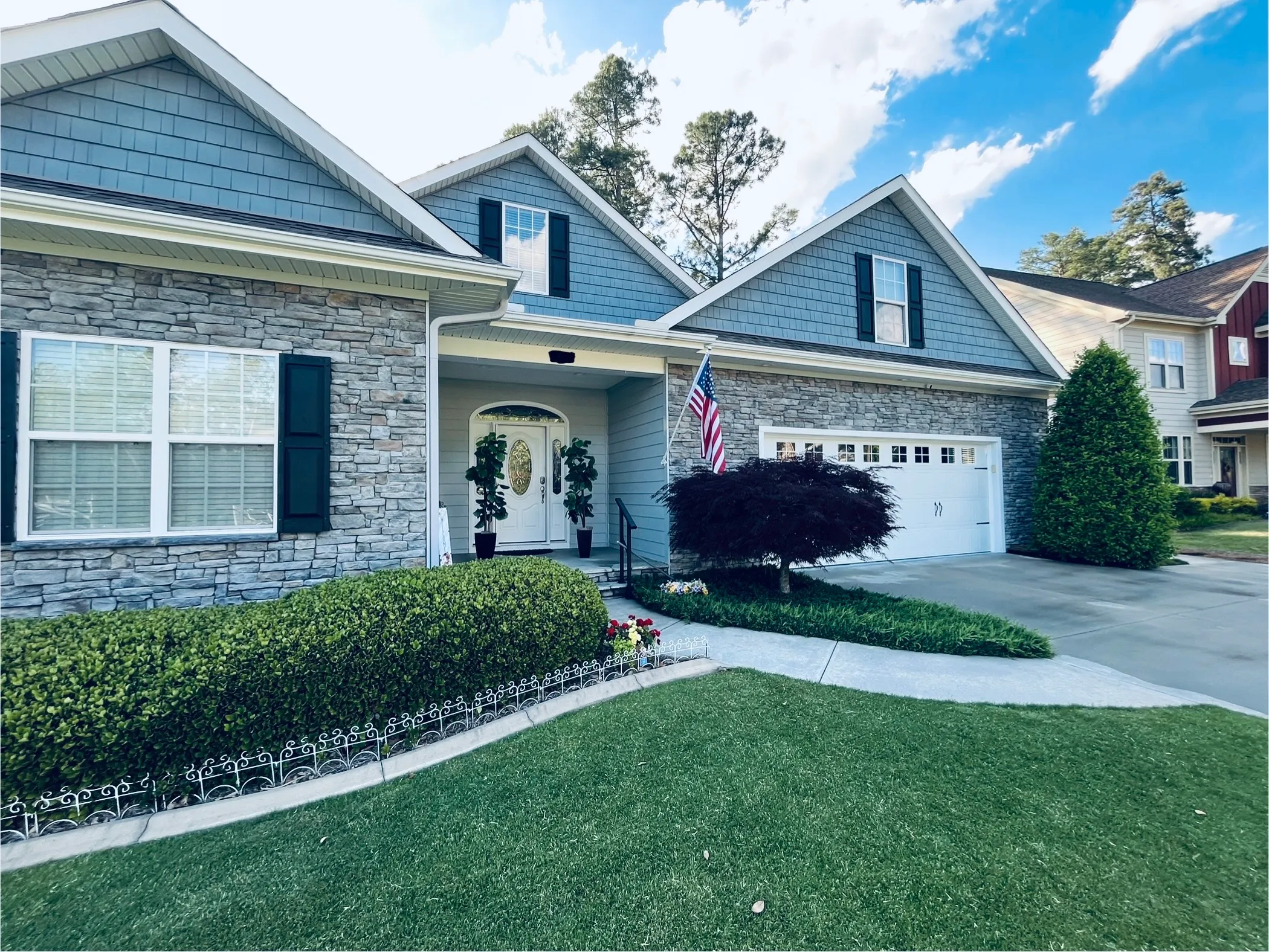  Pinehurst home with pressure-washed siding and porch area.