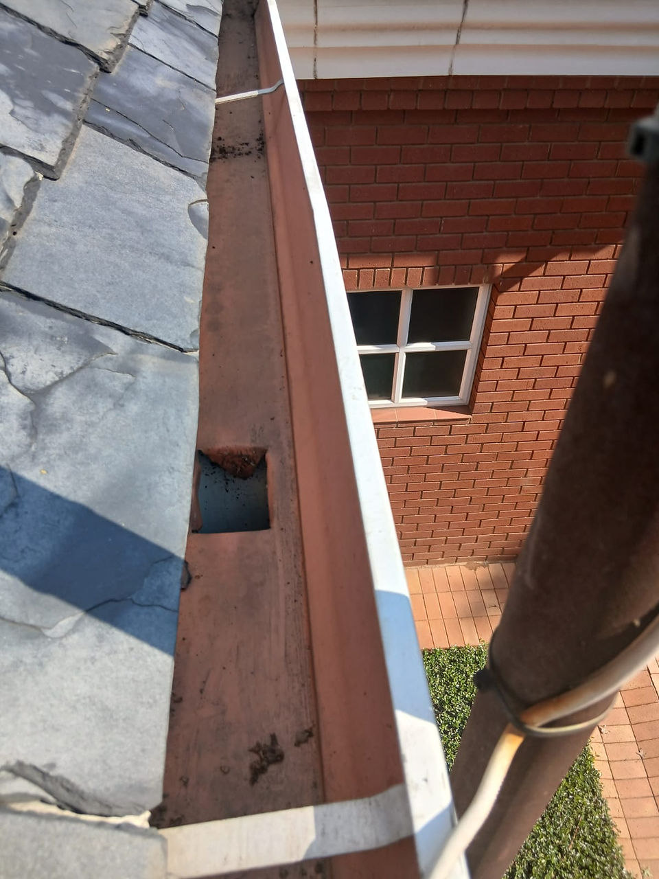 Before & After Gutter Cleaning by Nsimeko Projects.