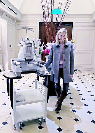 Emily, owner, with embroidery machine at Hotel Swexan for a private event