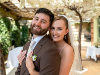 Smiling young couple embracing in bear hug during their wedding at the Sun Pavillion Harrogate  