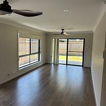 Spotless vacated living room with clean floors and empty surfaces after a professional end of lease clean by Kav Cleans, servicing South- West Sydney