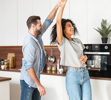 Couple dancing in kitchen