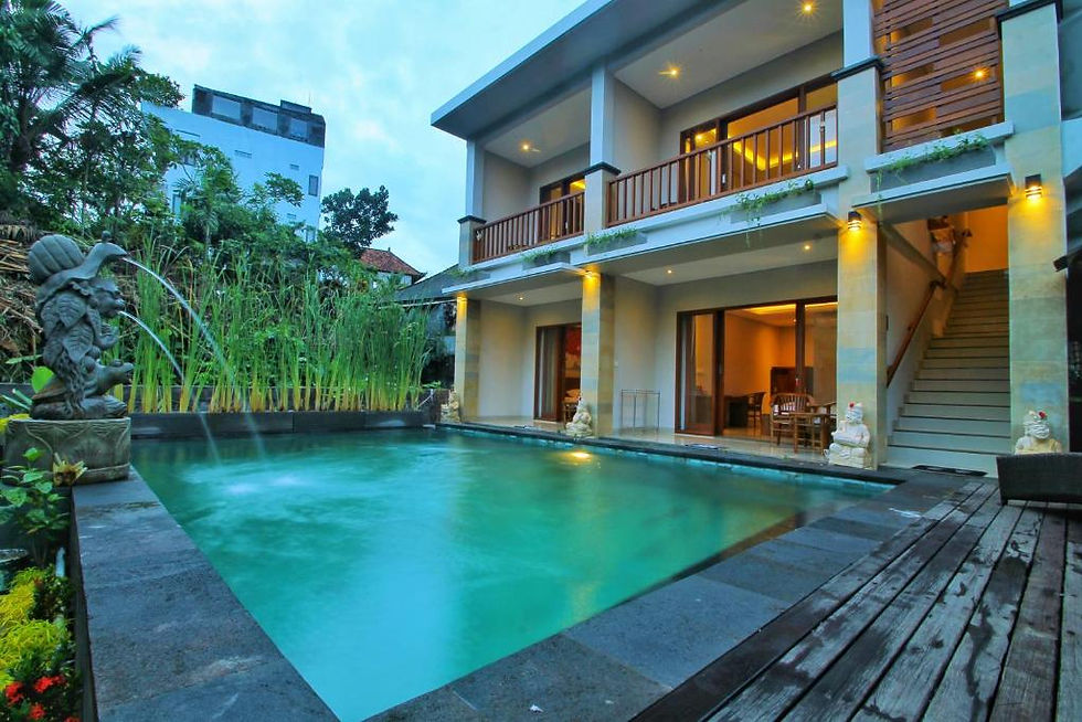 Boutique hotel room in Ubud decorated in traditional Balinese style with jungle views