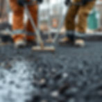 Show black ice gravel being laid by groundworkers on a construction site close up.jpg