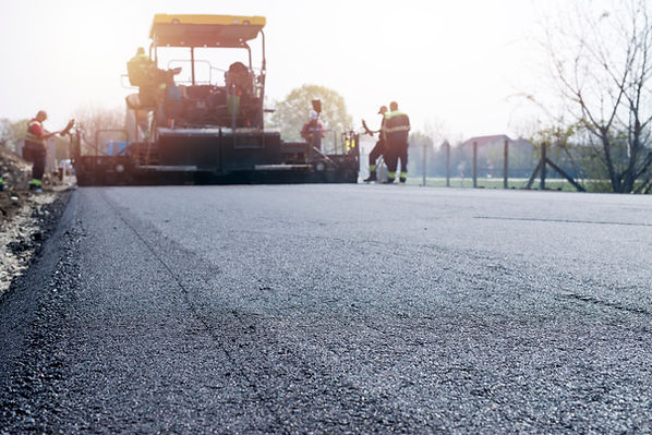 workers-placing-new-coating-asphalt-road.jpg
