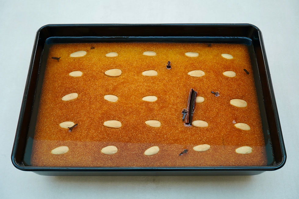 Şamali baked with syrup added. The syrup is sitting on top of the cake.