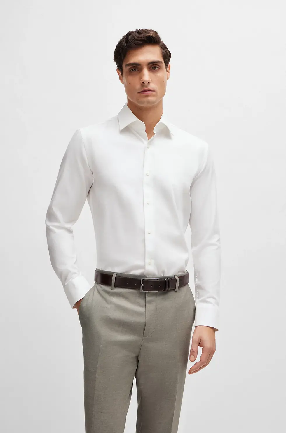 Man in white dress shirt and pants