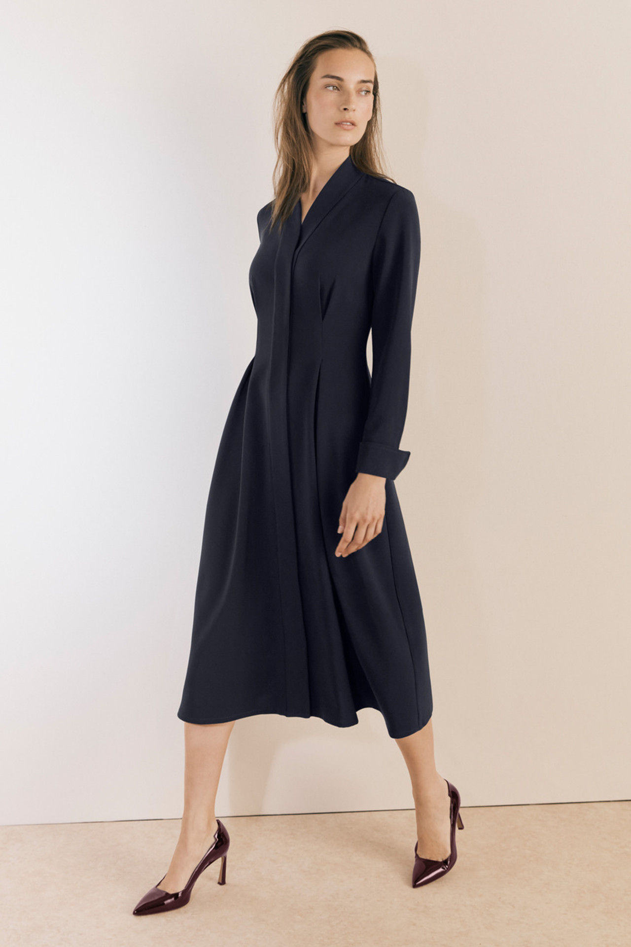 Woman in navy midi shirt dress