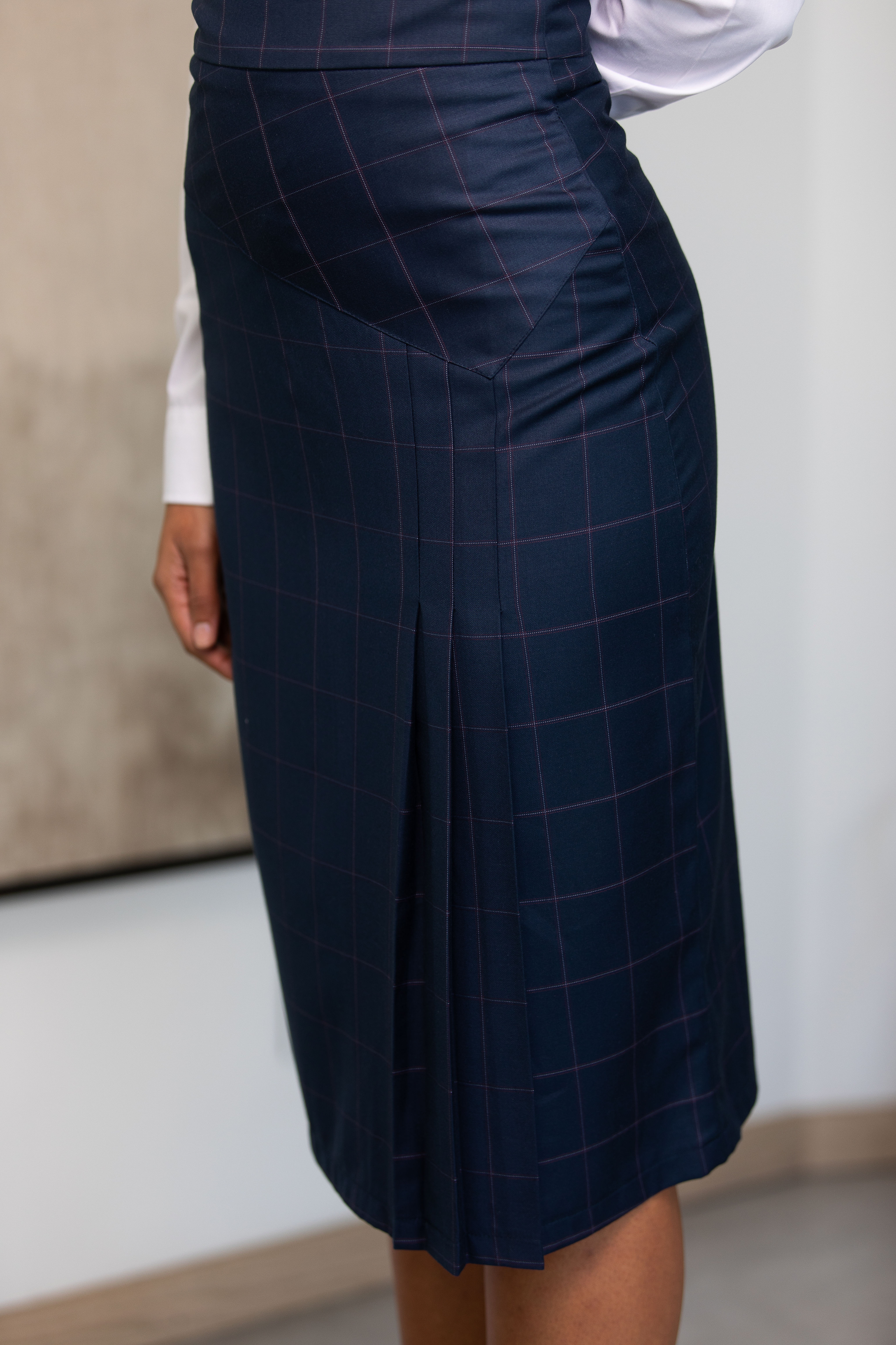 Navy grid patterned apron detail