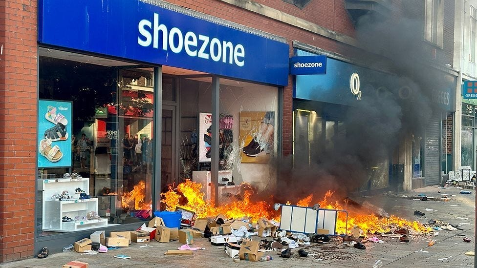 A 'Shoezone' damaged and on fire