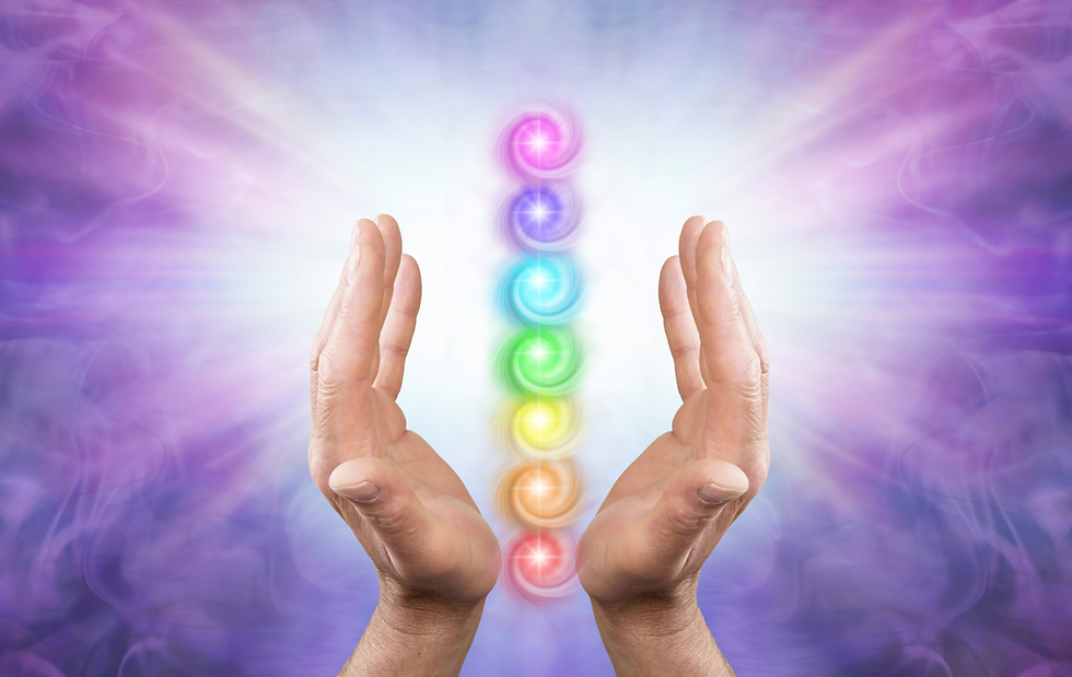 Glowing chakra symbols between open hands.