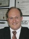Portrait of a smiling professional man in a suit.