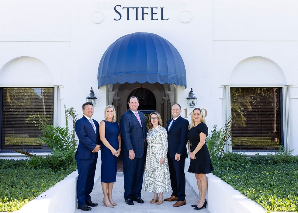 The Stifel team standing in front of their office building.