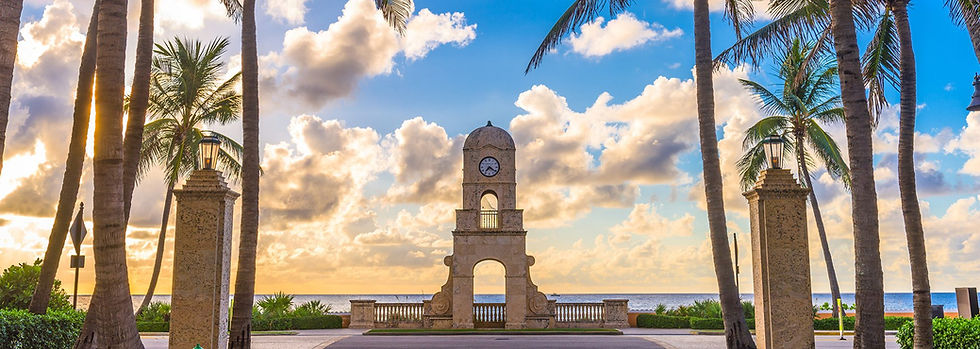 Palm Beach clock tower at Worth Avenue under a sunset sky