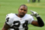 Charles Woodson giving salute at football game