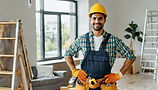 smiling-construction-worker-tool-belt-upgrading-home-interior.jpg