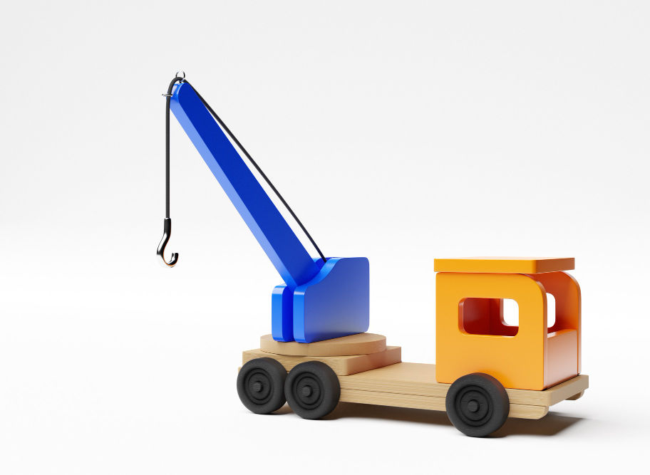 Wooden toy crane truck, blue crane, orange cabin against white background. I'm a product.