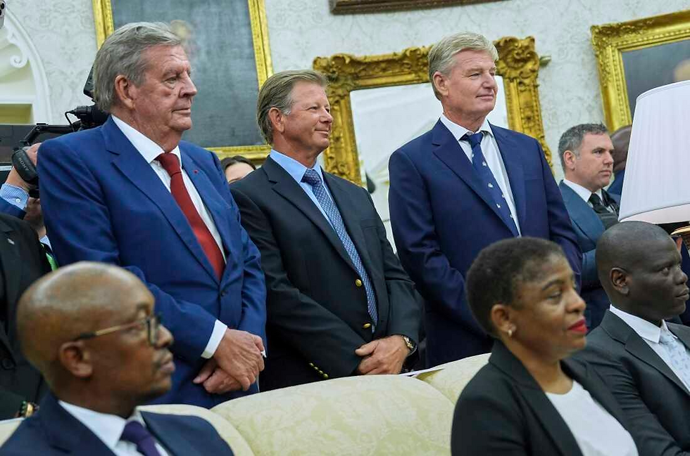 Standing from left, South African businessman Johann Rupert and golfers Retief Goosen and Ernie Els look on as President Trump meets South African President Cyril Ramaphosa in the Oval Office of the White House on Wednesday