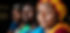 woman-with-colorful-headscarf-shows-concern-while-others-look.jpg
