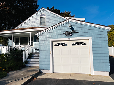 House freshly painted blue by ERST Painting
