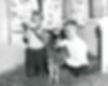 Two kids feeding calf.jpg