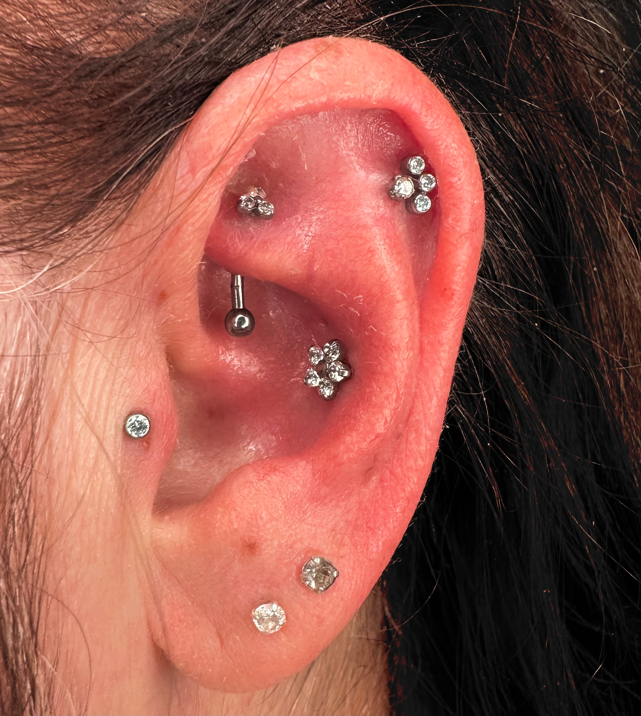 Double helix store tragus piercing
