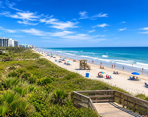 Cocoa Beach shoreline with palm trees and ocean waves on Florida’s Space Coast