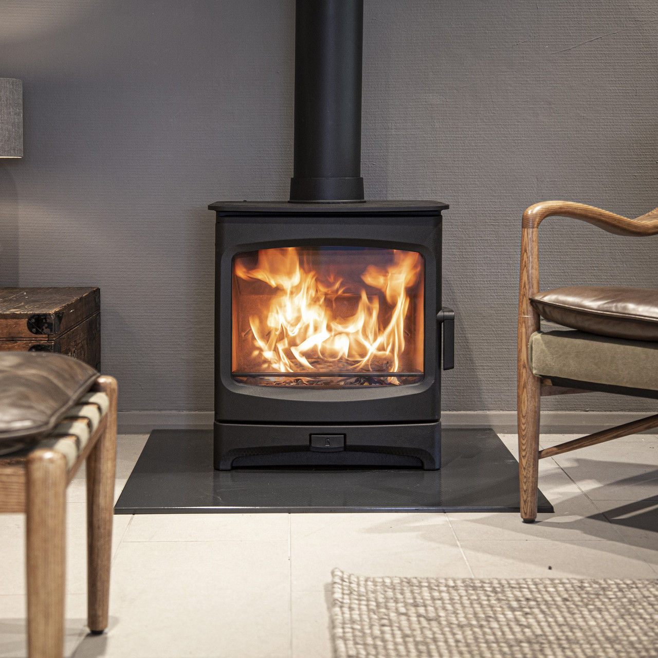 Charnwood Aire 7 Low BLU woodburning stove with fire lit