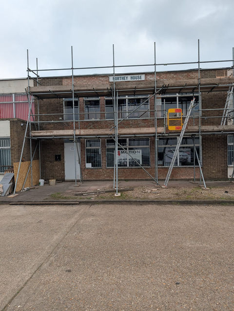 Commercial windows installation on a building with scaffolding