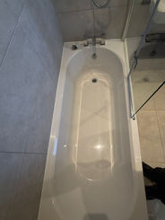 White rectangular bathtub in a bathroom
