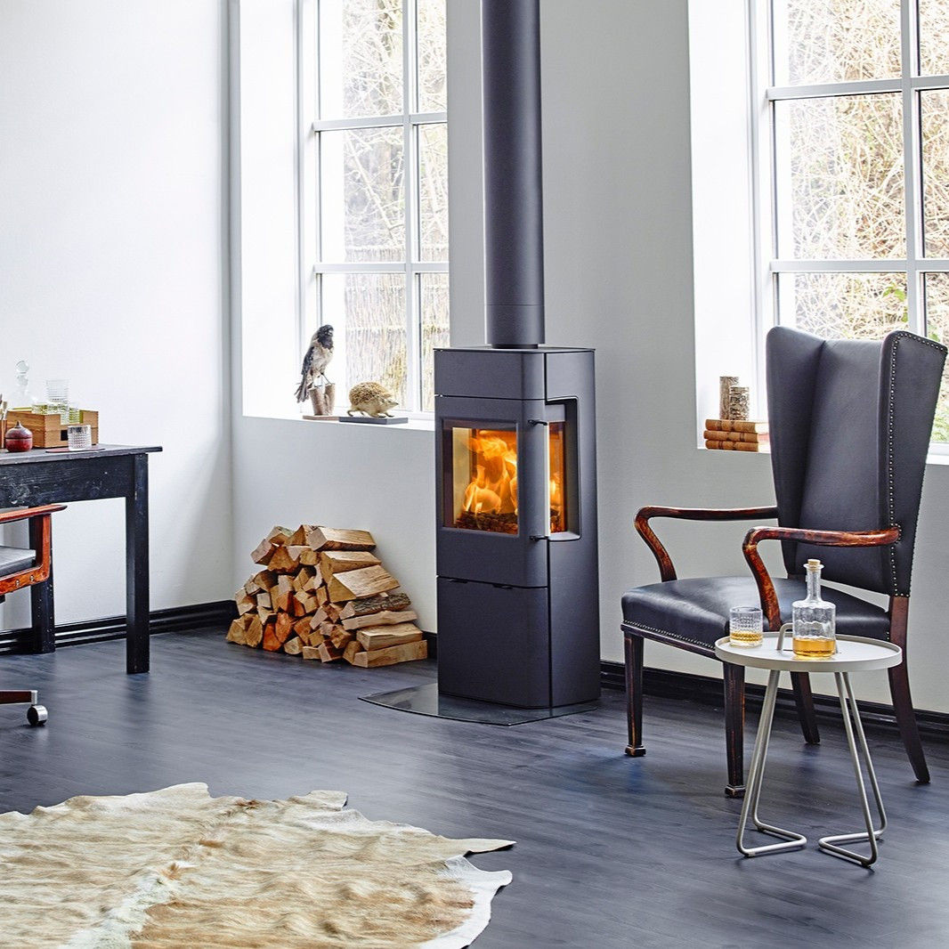 Scan 41-2 wood burning stove with side glass in a room