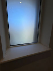 Window with condensation on glass and a sill
