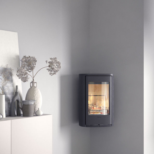 Wall-mounted Contura 810W wood burning stove in a room