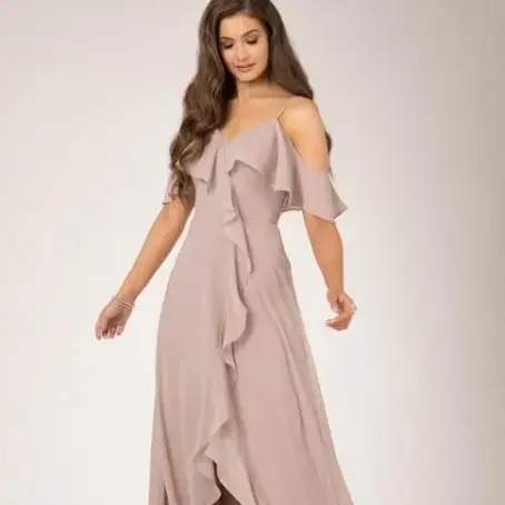 Woman in light pink off-shoulder ruffled gown