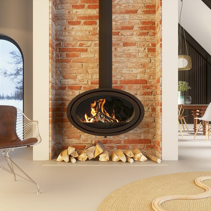 Dik Geurts Oval Front wood burning stove on a brick wall