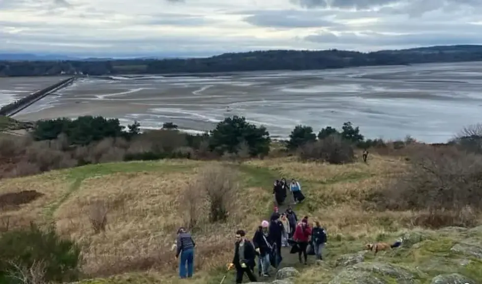 Volunteers walking toward Cramond beach for a litter pick.