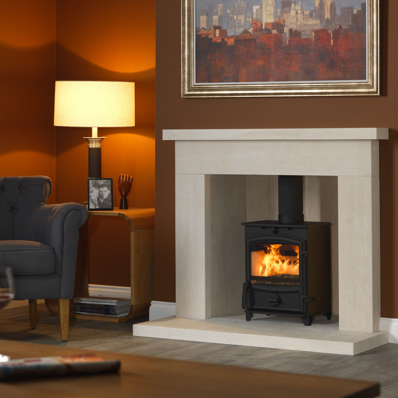Charlton and Jenrick Fireline FX5 multi fuel stove in a stone fireplace