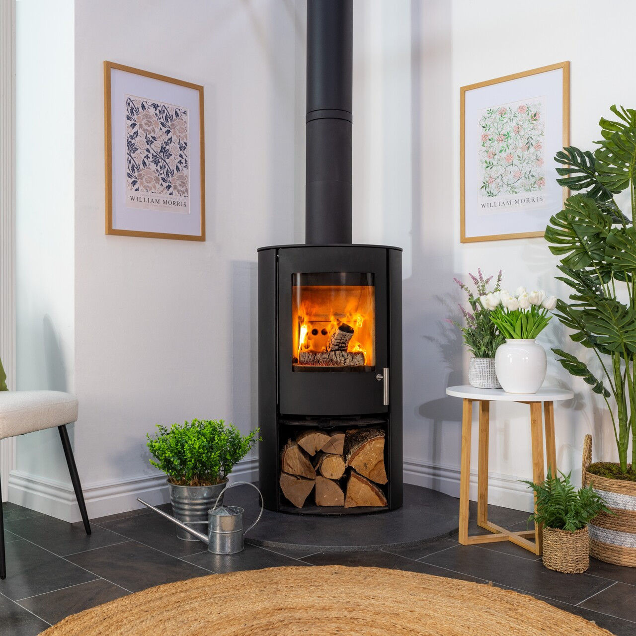 Charlton & Jenrick Woodtec FCS Cylinder stove with fire lit.
