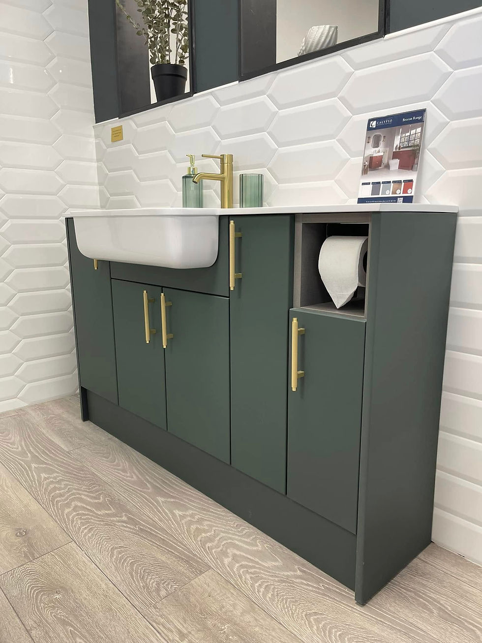 Man in a modern bathroom opens a drawer beneath a countertop with a round sink and silver tap.