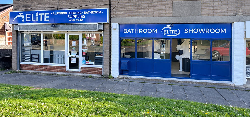 Modern showroom exterior with large glass windows displaying bathroom fixtures inside.
