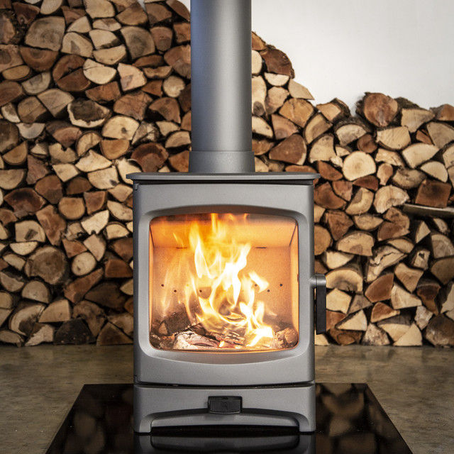 Charnwood Aire 5 woodburning stove with fire and log pile