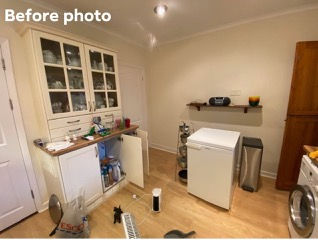 Before photo of a cluttered kitchen with white cabinets