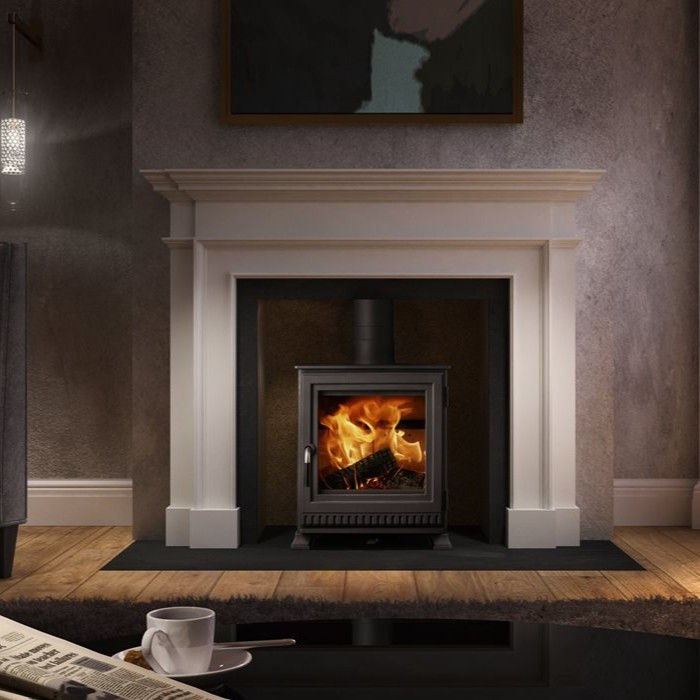 Dik Geurts Aste 5 wood burning stove in a classic mantle