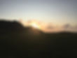 sunlight coming over a hill representing ease and relaxation