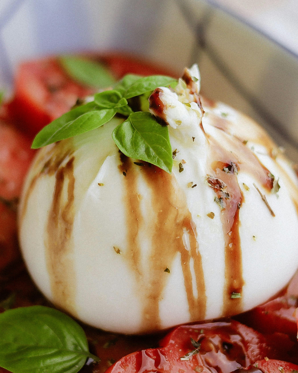 Fresh Mozzarella with basil, tomatoes, and balsalmic