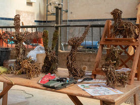Willow creations displayed, from rabbits, highland cows and willow craft tools