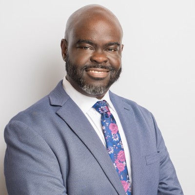 Smiling man in a suit and floral tie