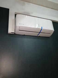 Systemair VRF wall-mounted unit installed in a server room for precise climate control.