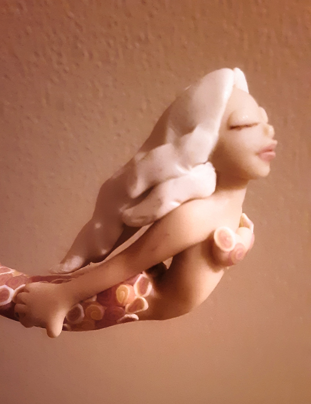 A miniature mermaid handcrafted by my aunt Teri (only a few inches long!)